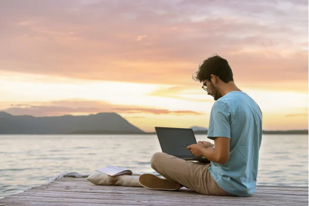 Non-resident checking capital gains tax in Portugal next to a lake